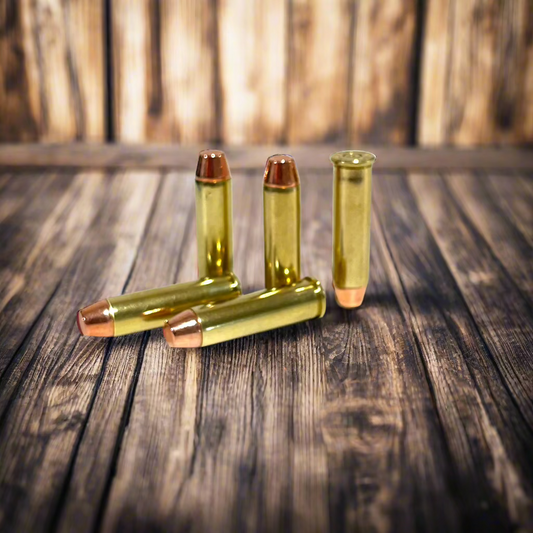 Multiple .38 Special brass dummy rounds scattered naturally across a rustic wooden table surface.