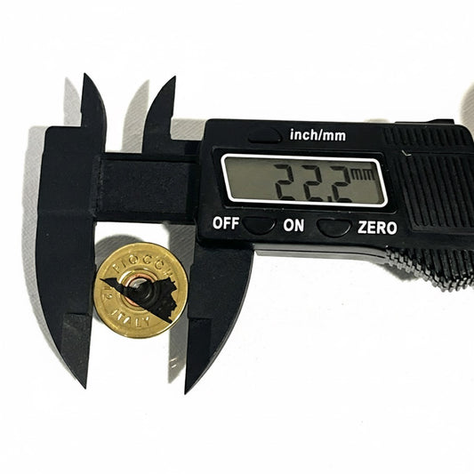 Digital caliper measuring the diameter of a gold 12 gauge shotgun shell slice with engraved Virginia silhouette showing 22.2 mm