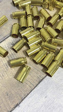 Load and play video in Gallery viewer, 40 Caliber Smith and Wesson Empty Brass Shells Cleaned Polished Used Casings Once Fired