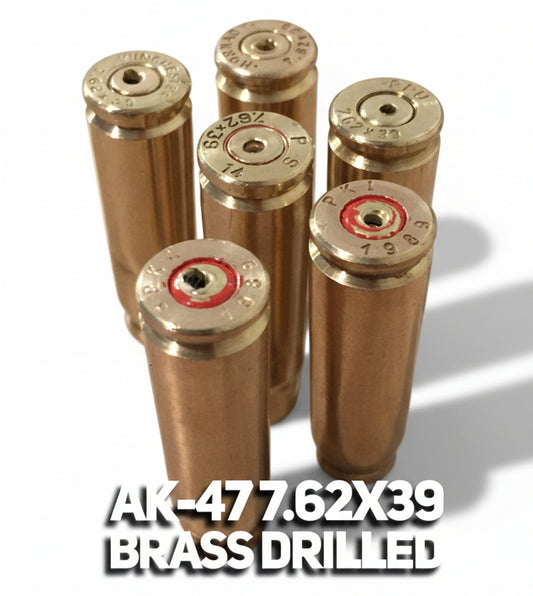 Five spent brass shells standing headstamp-up on a stone background, two showing red primer sealant, with an overlay caption.