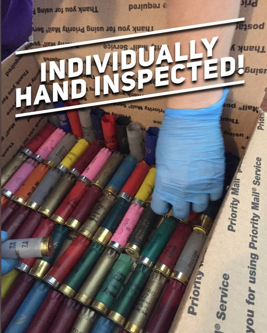 Gloved hand inspecting 12ga shells. Text: HAND INSPECTED! Inert 12ga shells for crafts (no powder/primers).