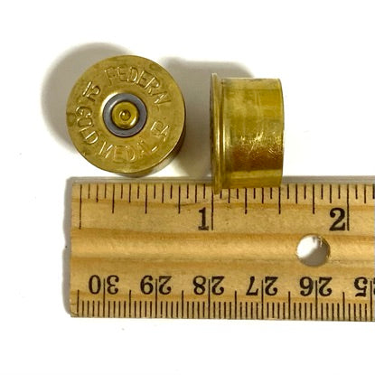 Size comparison of gold 12 gauge shotgun shell headstamps