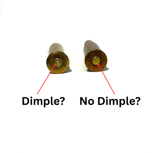 Side-by-side comparison of two brass cartridge bases. The left shows a safe, spent primer with a firing pin dimple. The right shows a live, untouched primer with no dimple.