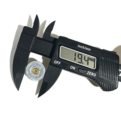 Digital caliper measuring a silver 20 gauge shotgun shell slice's diameter at 19.4 millimeters