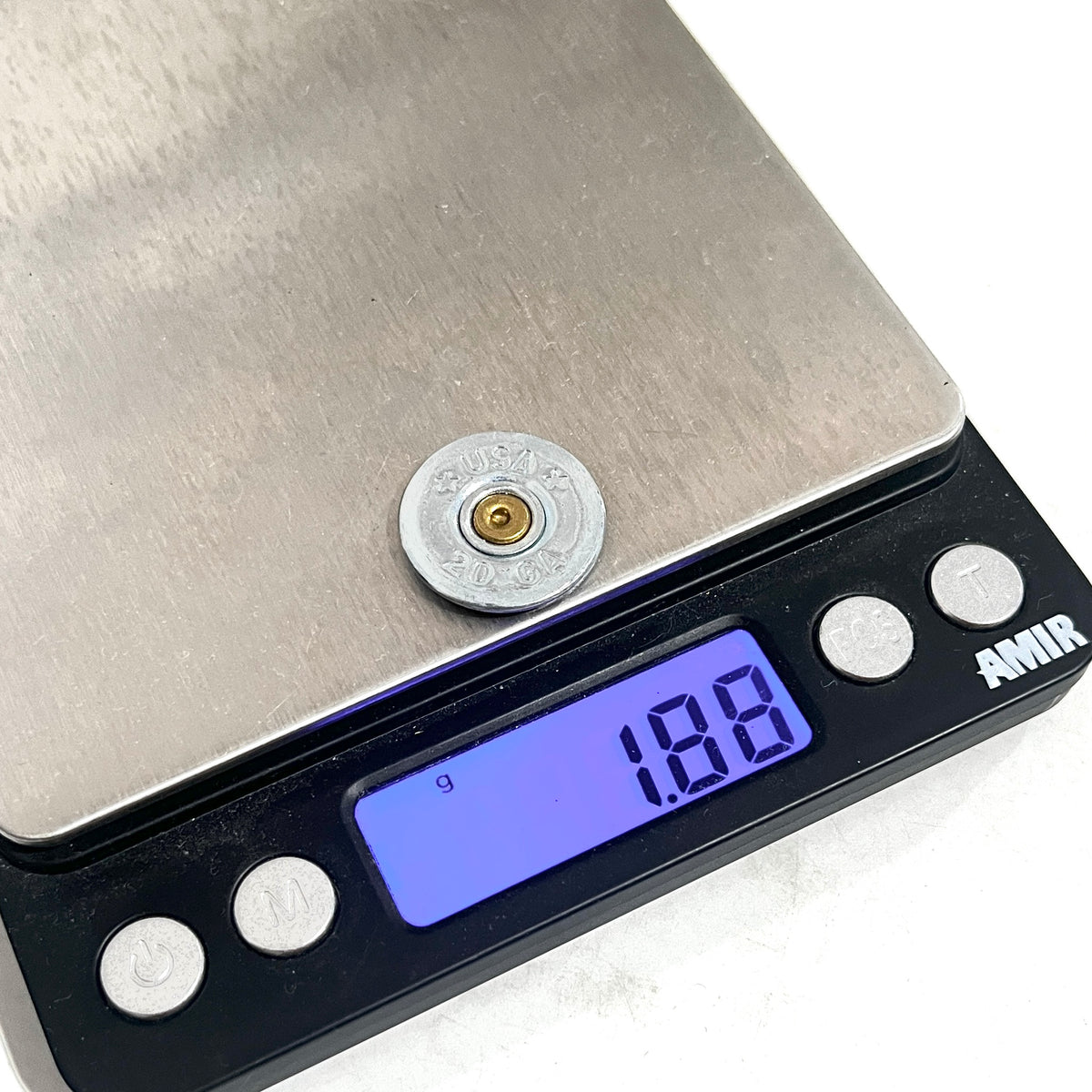 Silver 20 gauge shotgun shell slice on a digital scale reading 1.88 grams