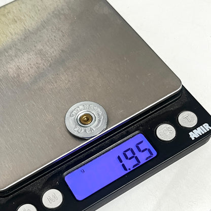 Winchester 20-gauge shotgun shell slice on a digital scale reading 1.95 grams in weight