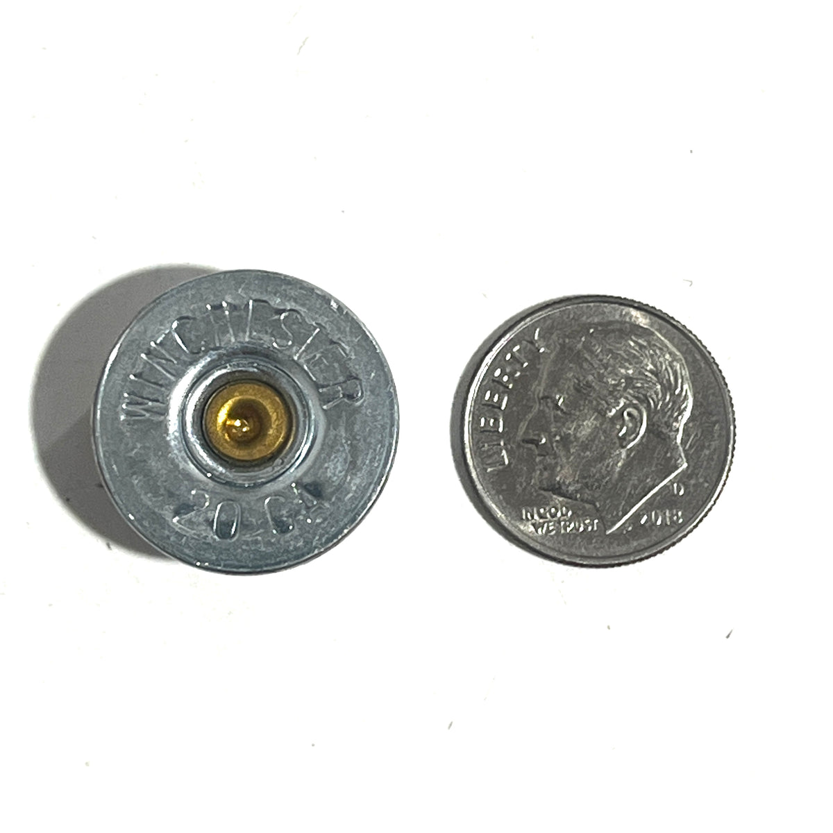 20ga silver headstamp US dime for reference on white background