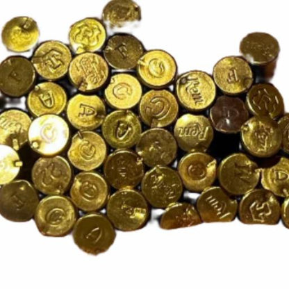 Close-up of brass shell headstamps showing various manufacturer markings viewed from above