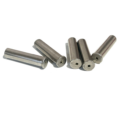 5 empty nickel .22 caliber shells with drilled holes through the base, arranged diagonally on a white background