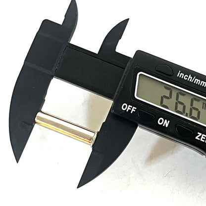 Digital caliper measuring the length of a nickel .22 caliber spent shell at 26.6 mm