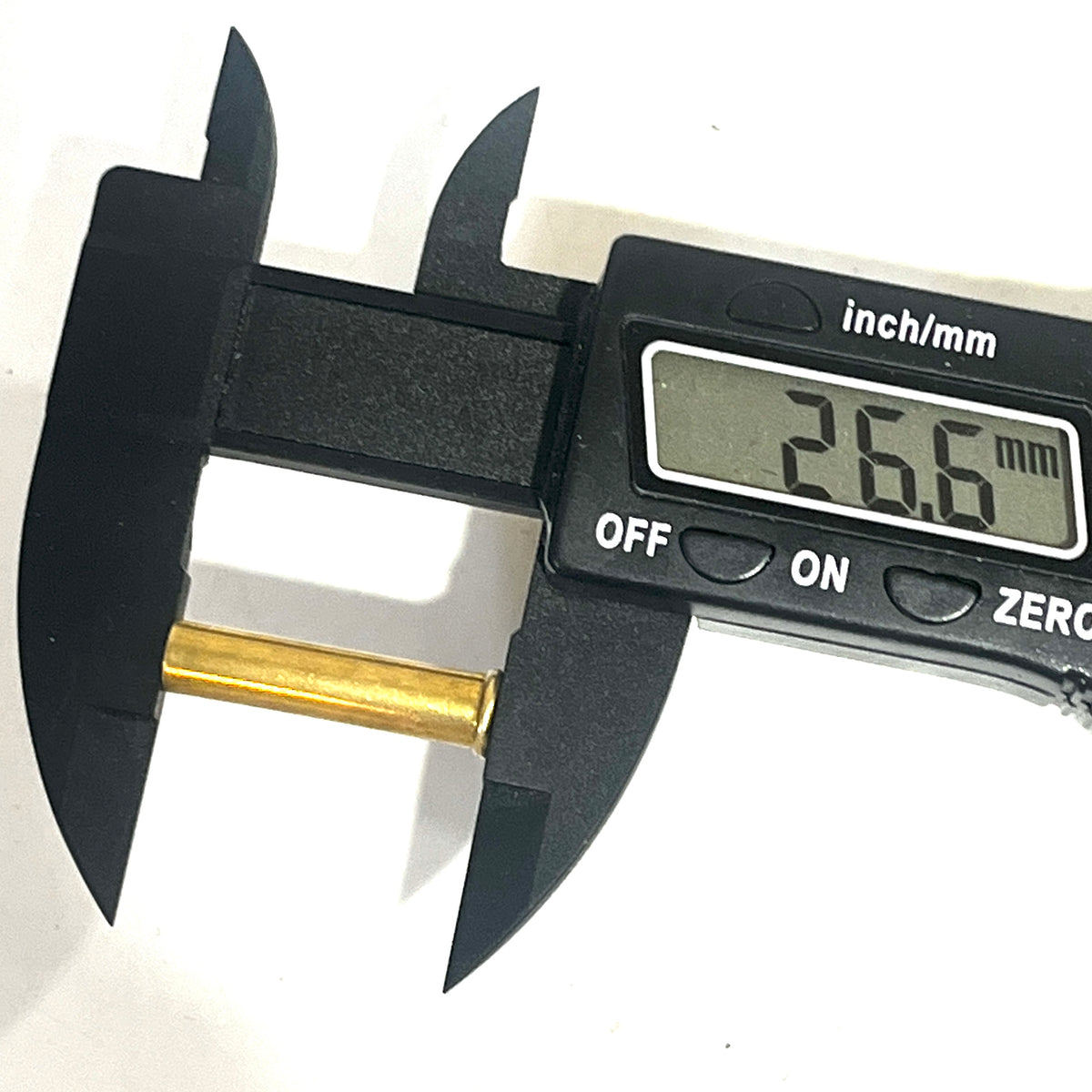 Digital caliper measuring the length of a brass 22 caliber WMR shell showing 26.6 mm
