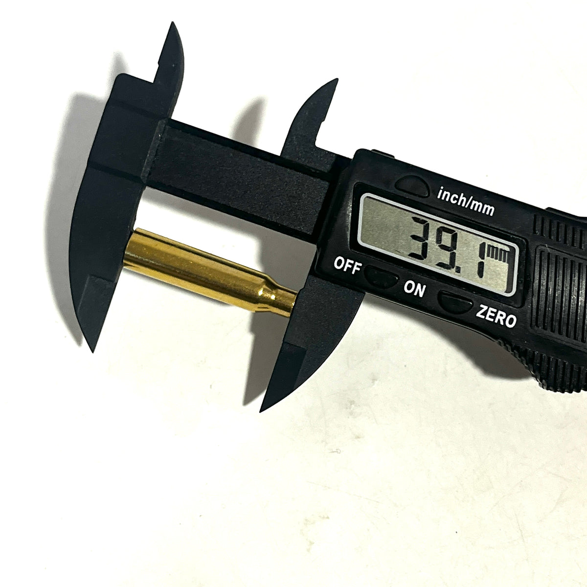 A .223 brass bullet casing bead measured with digital calipers showing a 39.1mm length