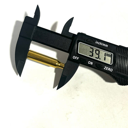 A .223 brass bullet casing bead measured with digital calipers showing a 39.1mm length