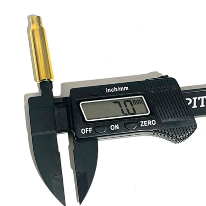 A .223 brass bullet casing bead measured with digital calipers showing a 7.0mm opening