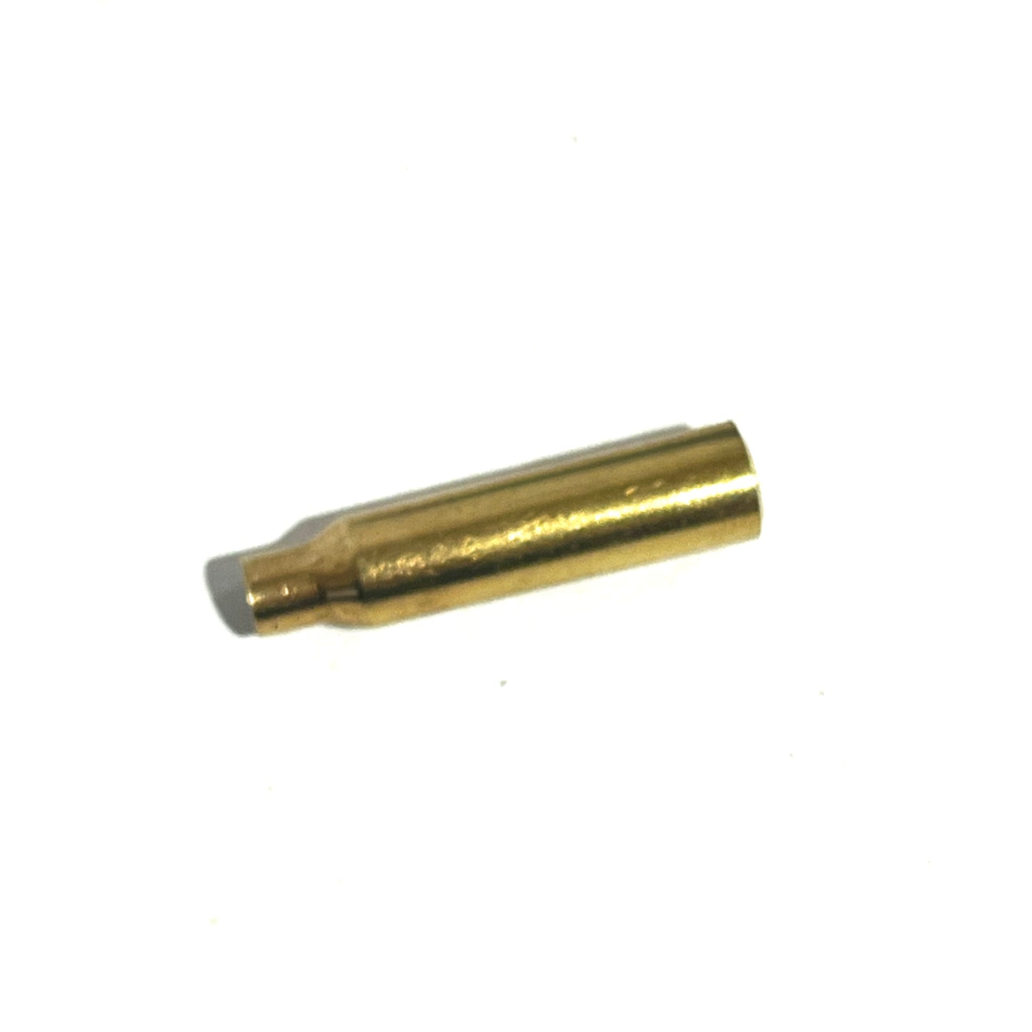 Close-up of a single .223 brass bullet casing bead on a white background