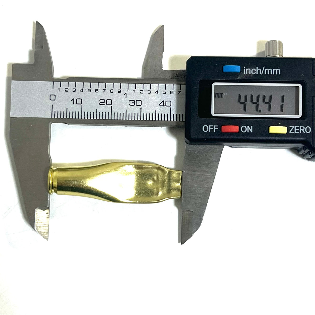 Digital caliper measuring the length of a brass .223 casing at 44.41mm