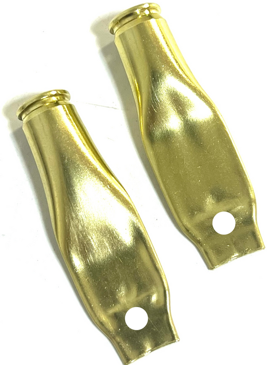 Two flattened brass .223 casings with a punched hole near the base, curved shape, white background