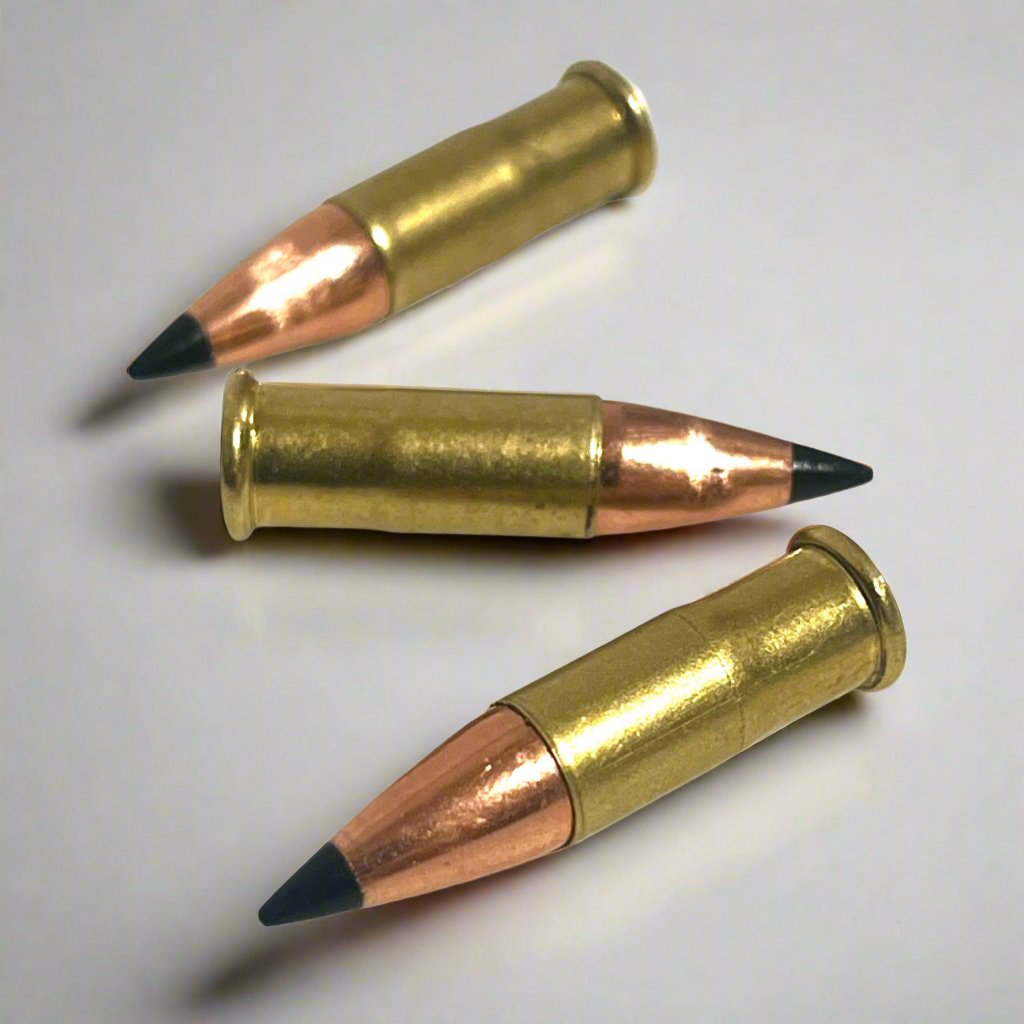 3 .22 caliber dummy rounds with black polymer bullet tips, lying on a white background