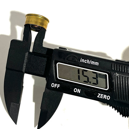 Digital caliper measuring a gold brass 28 gauge Fiocchi headstamp showing 15.3 mm on the display.