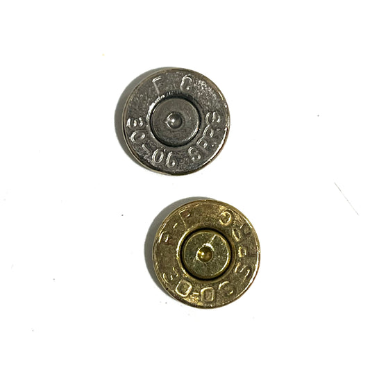 2 round bullet slices, one nickel with headstamp FC 30-06 SPRG and one brass, viewed from underside