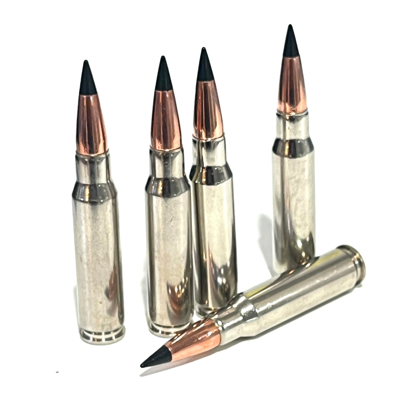 Five 308 dummy rounds with black tip copper bullet one lying down, 4 upright on a white background.