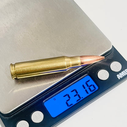 Single brass .308 snap cap on a digital scale reading 23.16 grams