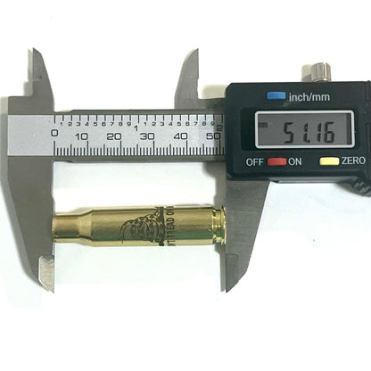 Single 308 WIN brass shell measured horizontally with a digital caliper showing a 51.16 mm length reading.