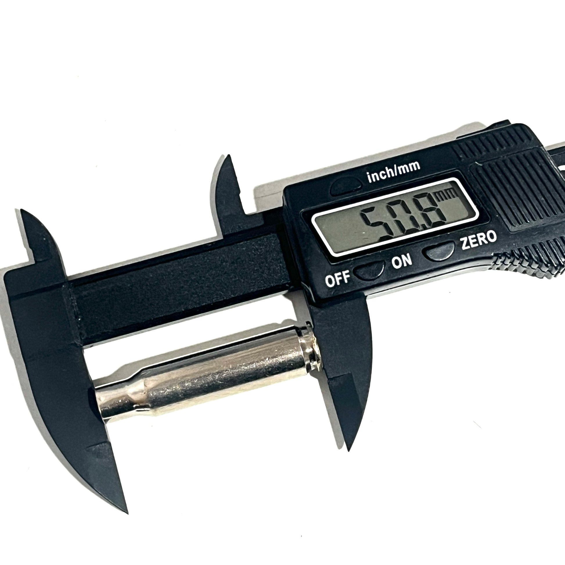 Black digital caliper measuring the full length of one silver .308 WIN shell, displaying 50.8 mm on a white surface.