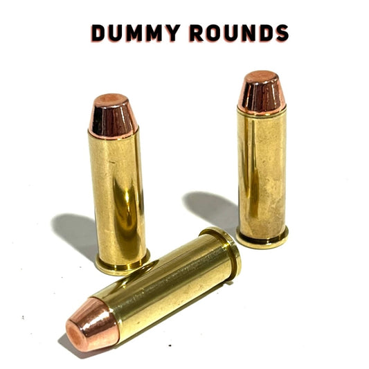 Five .38 Special brass dummy rounds with flat-nose bullets on a white background below a 'DUMMY ROUNDS' text overlay.