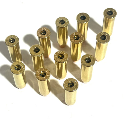 12 brass 38 Special deprimed cases with empty primer pockets, standing upright viewed from the base