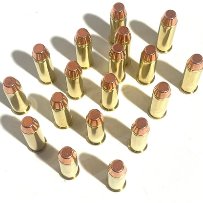 16 38 Special dummy rounds with flat nose bullets, mostly brass with a few nickel cases, standing upright on a white background