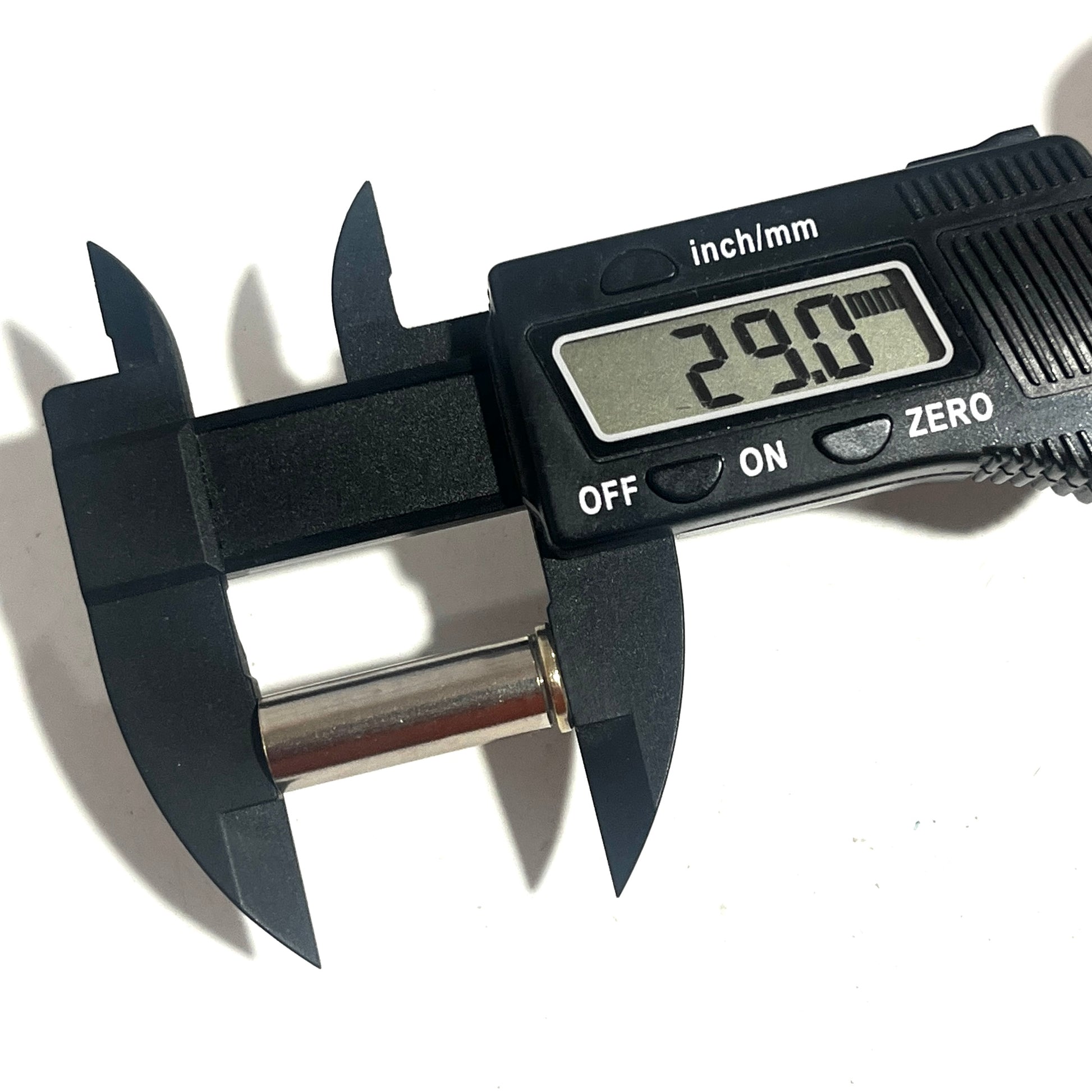 Digital caliper measuring a silver 38 Special casing, display reading 29.0mm, on a white background.