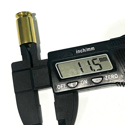 A gold 45 ACP brass casing's open mouth measured by a digital caliper, display reading 11.5 mm.