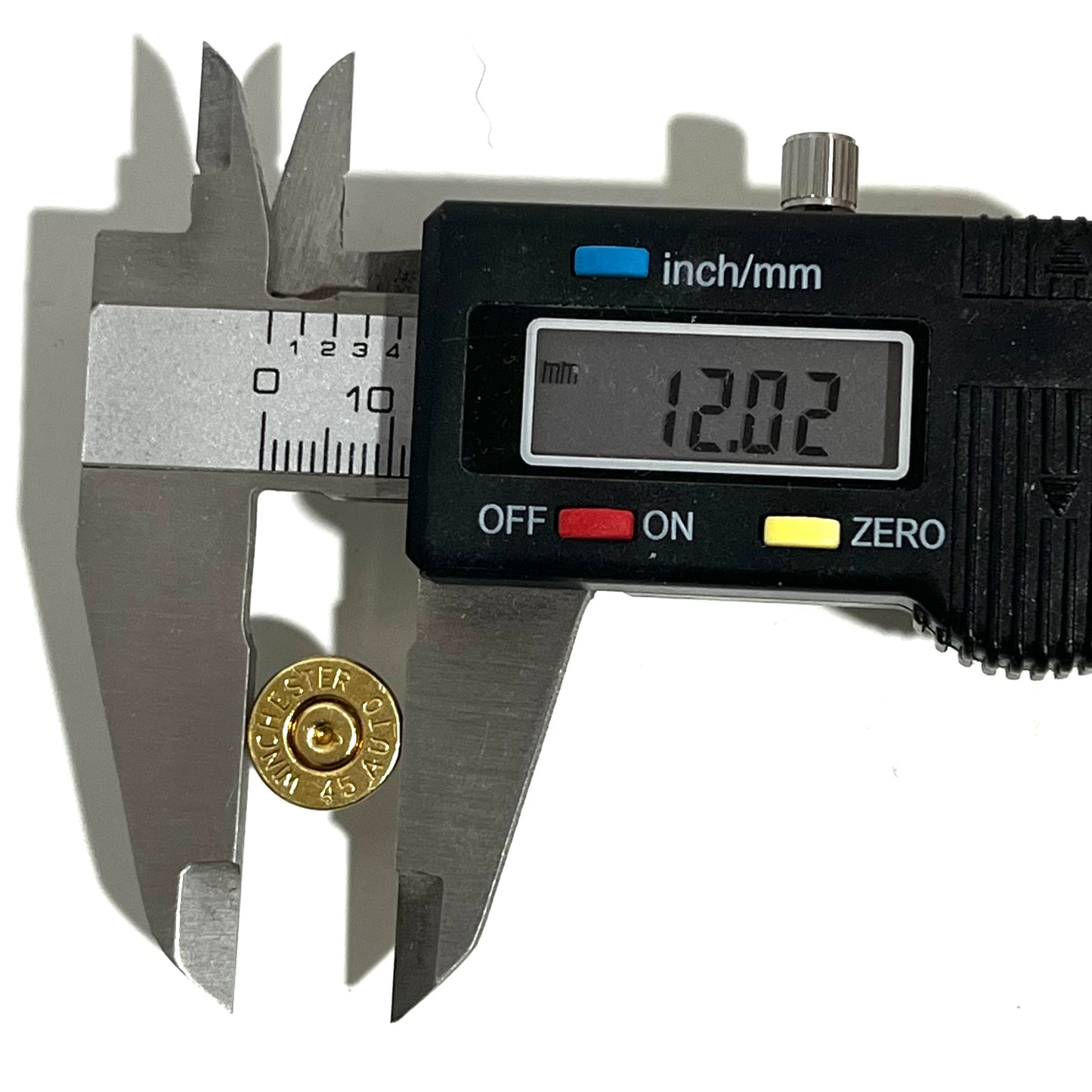 Digital caliper measuring a gold 45 ACP Winchester bullet slice's diameter at 12.02 millimeters