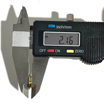 Digital caliper measuring a gold 45 ACP bullet slice's thickness at 2.16 millimeters