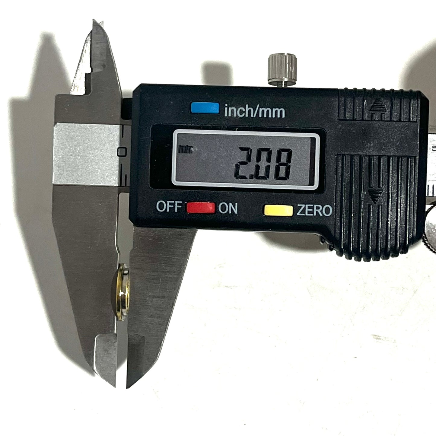 Digital caliper measuring a nickel 45 ACP bullet slice's thickness at 2.08 millimeters