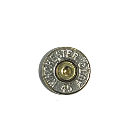 Close-up of a single nickel 45 ACP bullet slice with a gold primer, engraved Winchester 45 Auto headstamp