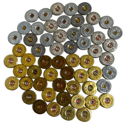 Fifty 12 gauge shotgun shell headstamp slices sorted into silver and gold clusters on a white background.