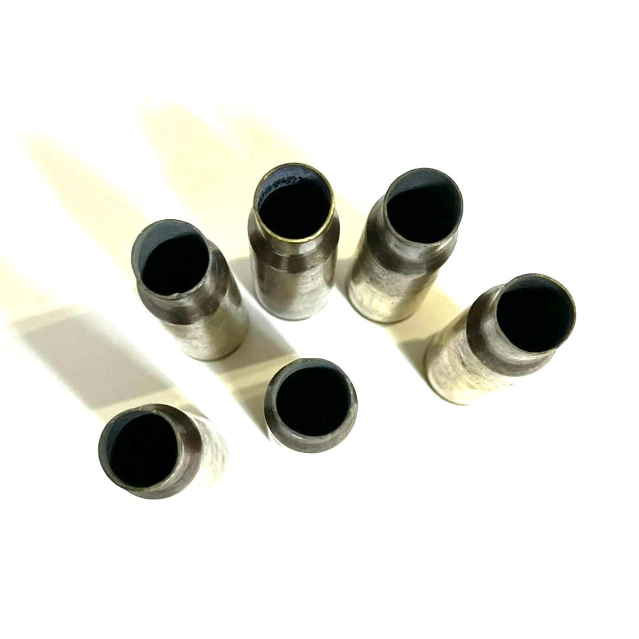 Once-fired .50 BMG brass casing, uncleaned, inspected for cracks before shipping.