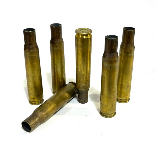 Genuine once-fired .50 BMG brass casing, shipped uncleaned with spent primer intact.