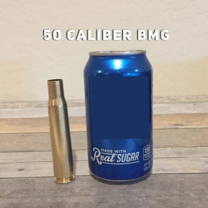 A once-fired brass 50 cal shell casing stands beside a soda can for size comparison, labeled '50 Caliber BMG'.
