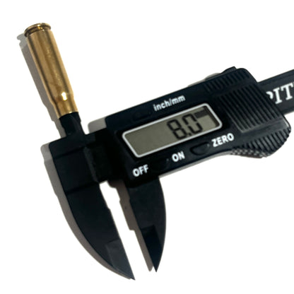 Used brass cartridge tip measured with a digital caliper, displaying a reading of 8.0 on a white background.