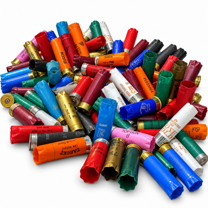 A pile of assorted colorful plastic shotgun shells arranged on a plain white background.