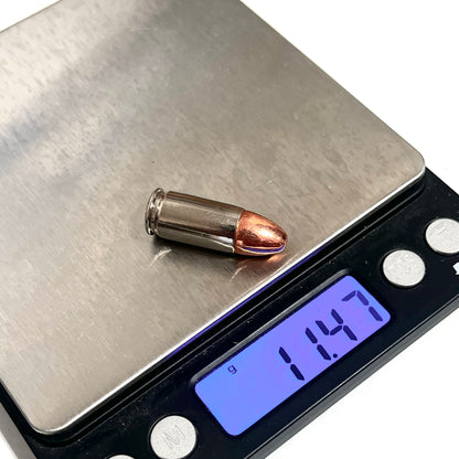 9MM Dummy Rounds Real Weight Snap Caps on a scale.
