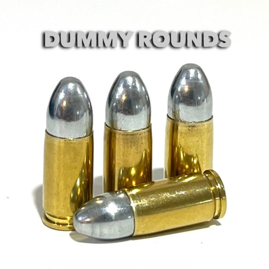 Four brass 9mm dummy rounds with silver bullets, grouped beneath a gray Dummy Rounds text banner.
