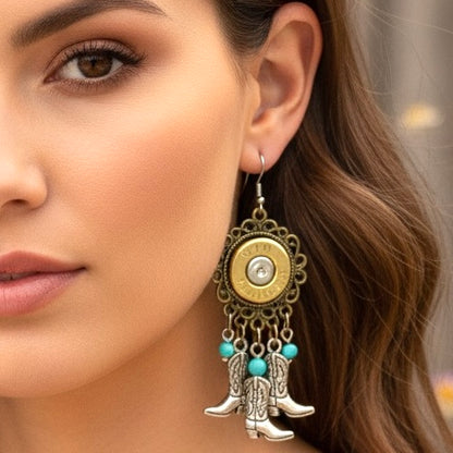 A woman wearing a bohemian style dangle earring made with a brass bullet slice and turquoise beads.