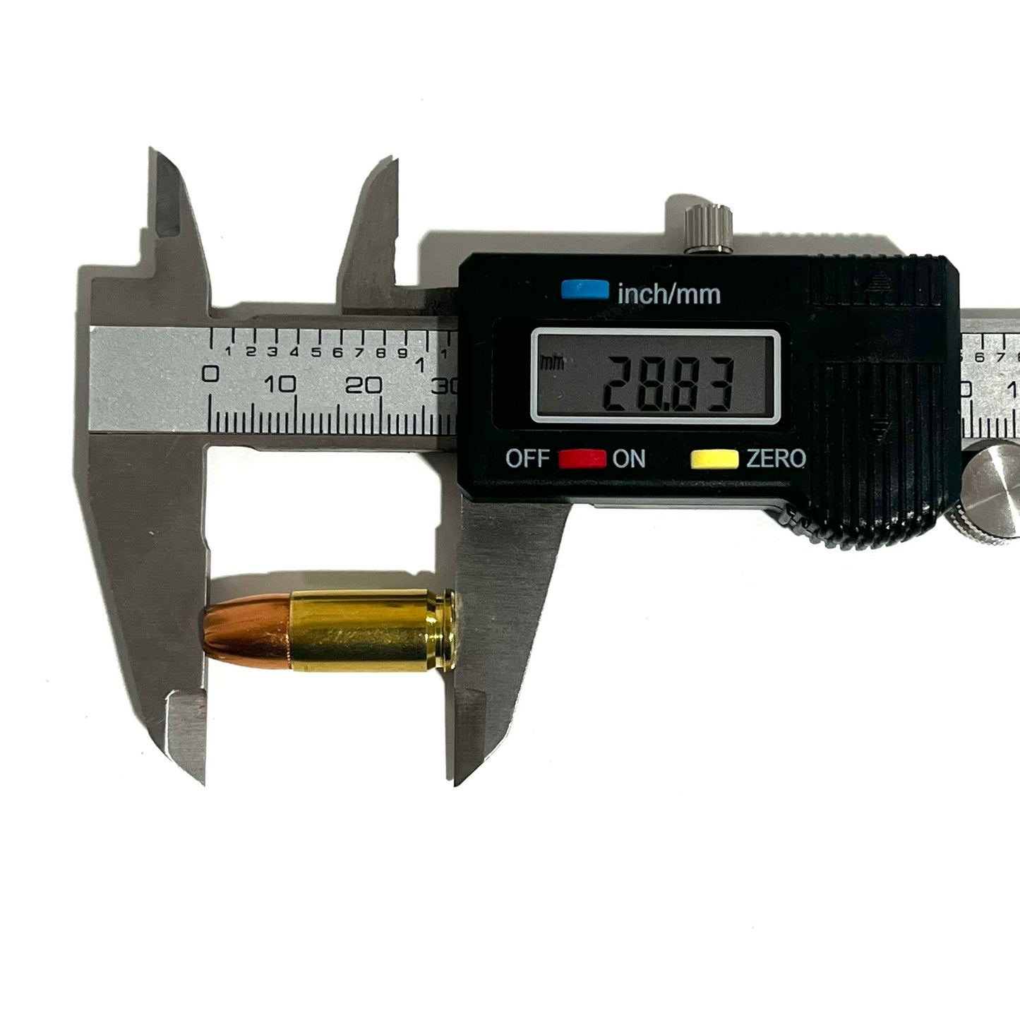 Black digital caliper measuring overall length of a 9mm dummy cartridge showing 28.83 mm on display.