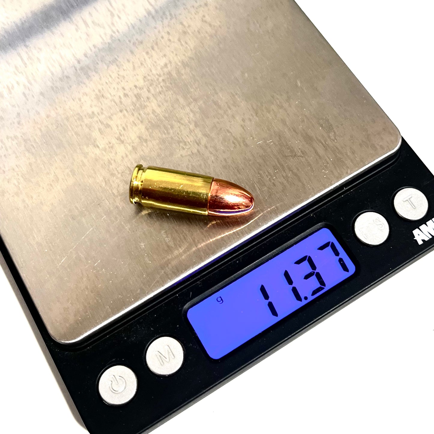 9mm dummy round on a digital scale weighing 11.60 grams for precise cosplay prop specifications and ammo crafts.
