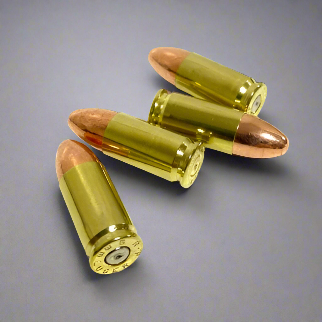 Four 9mm dummy rounds with G.F.L. Luger headstamps on polished brass casings with copper bullets.
