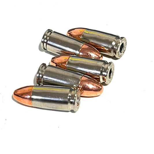 Five nickel 9mm dummy rounds with round-nose copper bullets fanned on a white background.